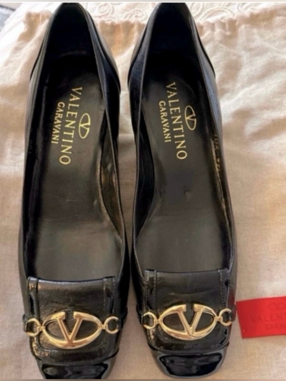 Valentino Garavani
Leather Black slip on
Shoes with Gold Valentino Accent